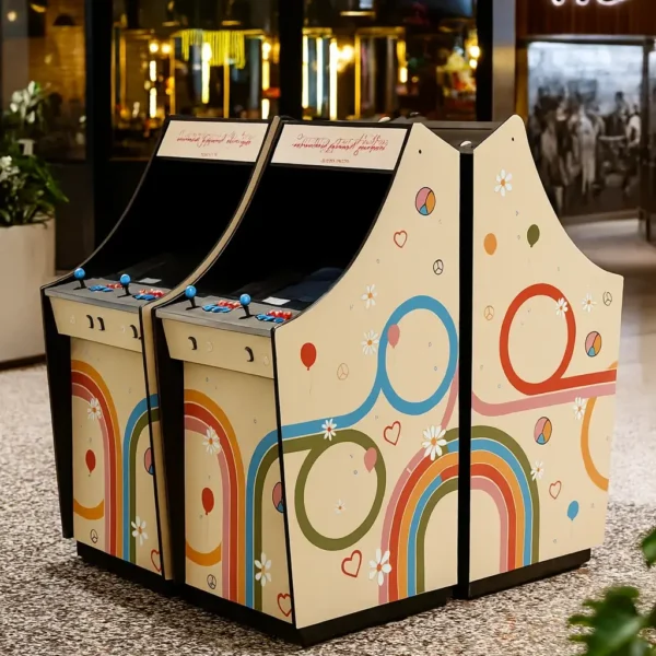 Retro rainbow wrapped arcade machines installed in a shopping centre environment