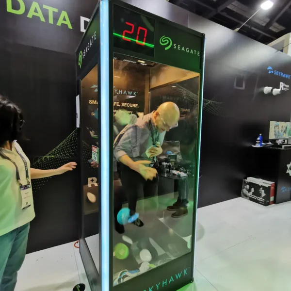 Participant collecting prizes inside a Seagate SkyHawk cash grab machine