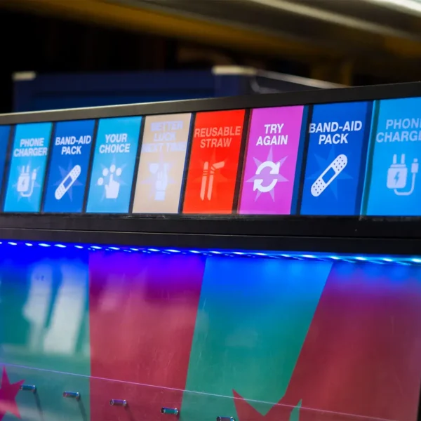 Close up of prize icons displayed across the top of a Prize Drop Plinko machine