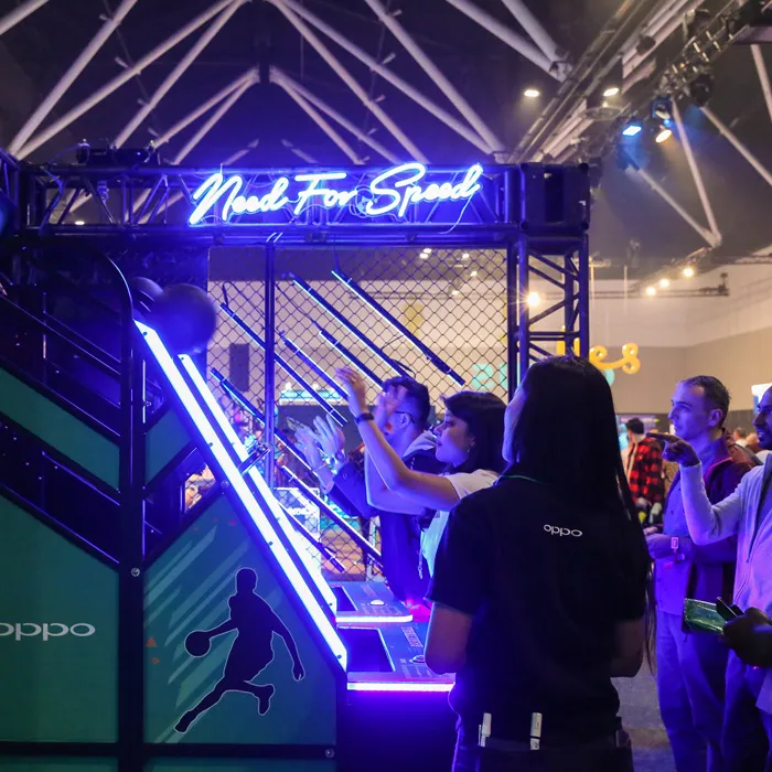 Oppo branded basketball arcade game with attendees playing at a live event activation.