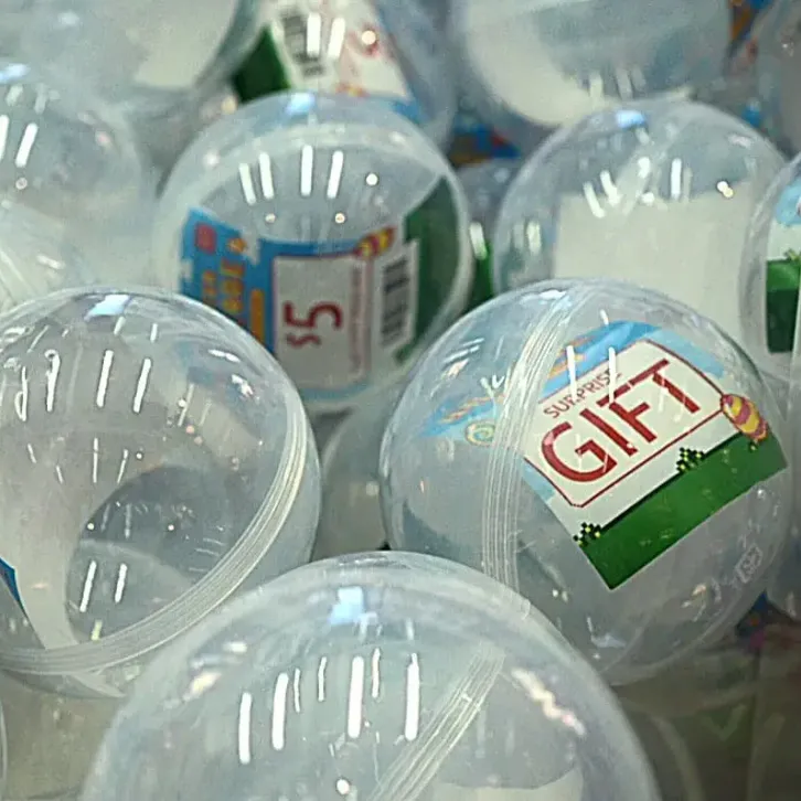 Plastic prize capsules inside a claw machine ready to be won
