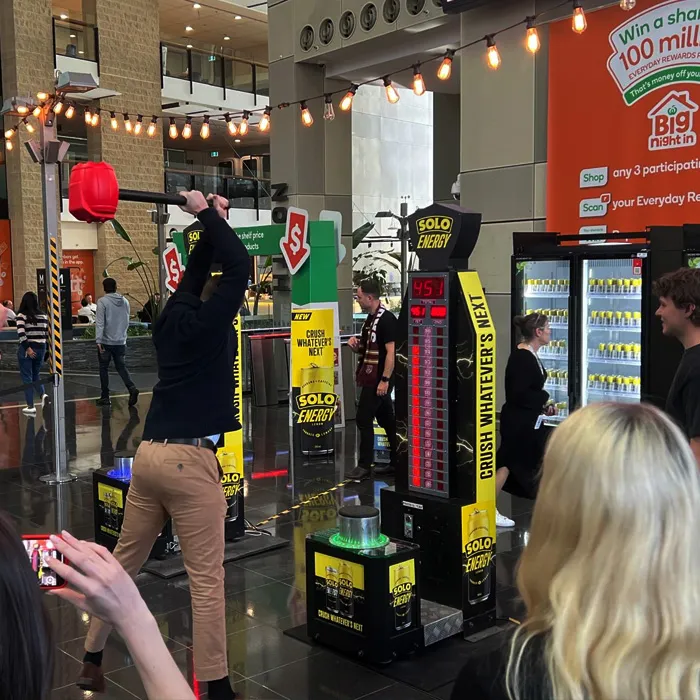 Solo Branded hammer game expo event with crowd.