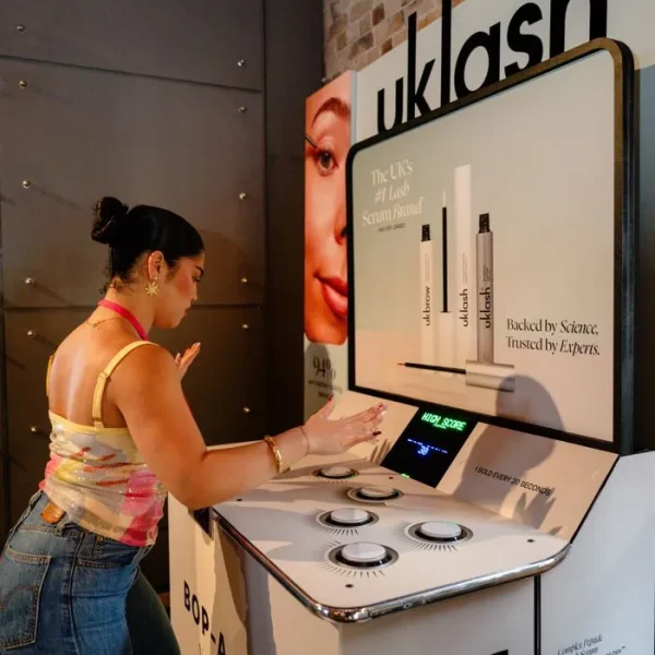 Person playing Whack-a-Light at UKLash brand activation